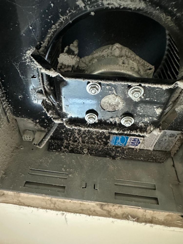 Dust accumulation inside HVAC air duct before professional cleaning
